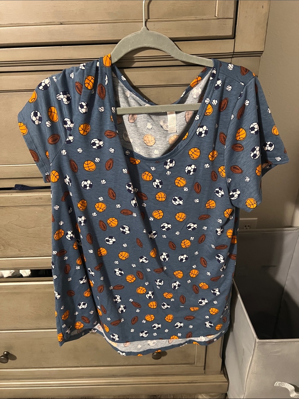 LuLaRoe Blue Short Sleeve Tee with Sports Ball Print